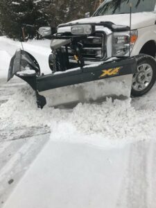 Vigh Landscape Management truck commercial for industries served snowplowing